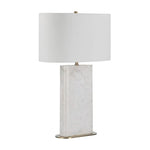 A white marble table lamp base with a natural honed finish, featuring a classic E26 socket, a dimmer switch, and an off-white linen shade, complemented by a brushed brass finished iron stem.