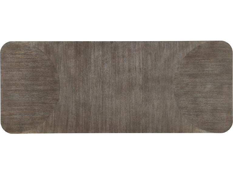 top of rectangular dining table with a dark wood finish on a white background