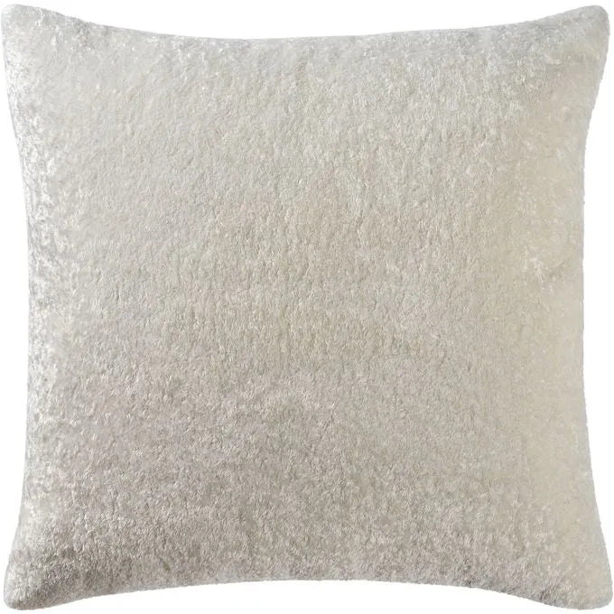A square-shaped white shearling throw pillow.
