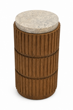 A modern cylindrical side table featuring a fluted dark brown wood body with three stacked tiers and a round light beige stone top, shown on a plain white background.