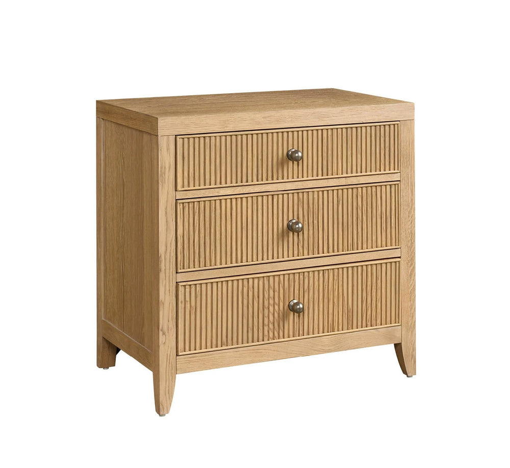 Wooden chest of drawers with three drawers on a white background