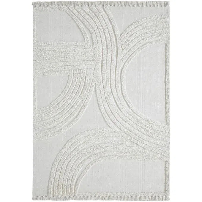 An off-white, hand woven cotton area rug with a geometric pattern and fringe edge.