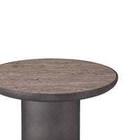 Round wooden table with a dark metal base on a white background