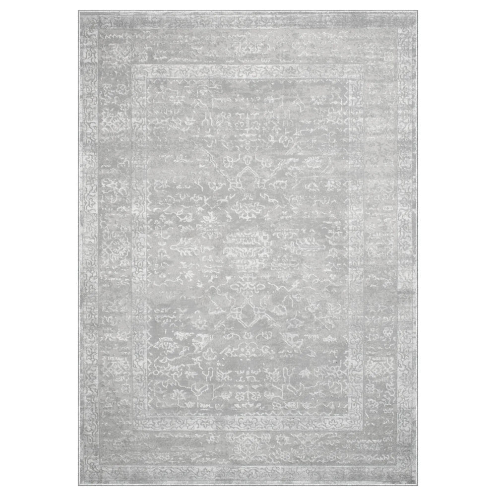 Gray area rug with subtle pattern on a white background