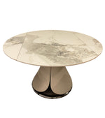 Alice Round Table
Round marble table with a unique base design on a white background