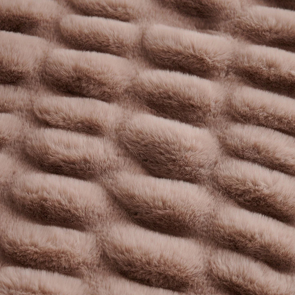 Close-up of textured brown fabric with wavy pattern