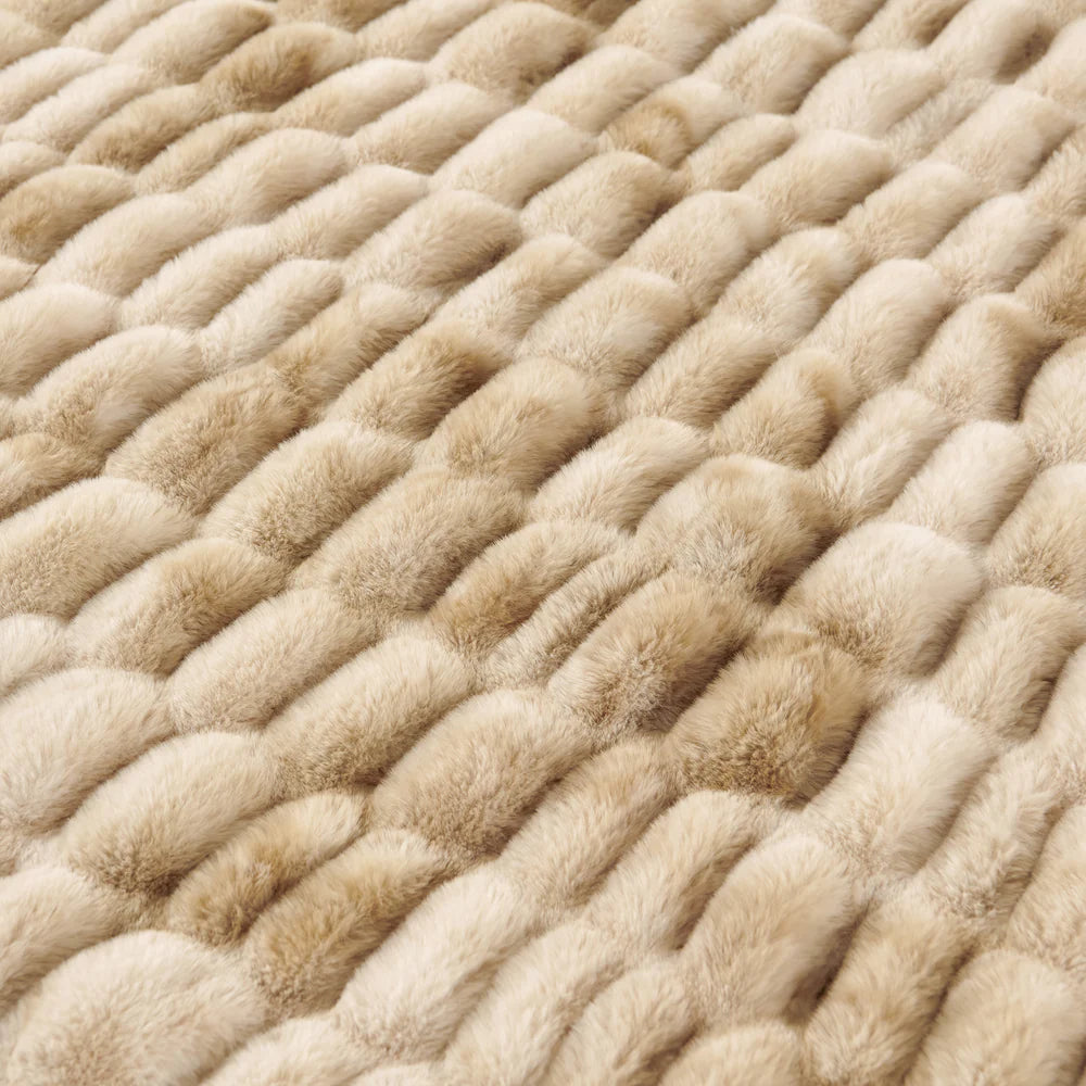 Close-up of a textured beige carpet