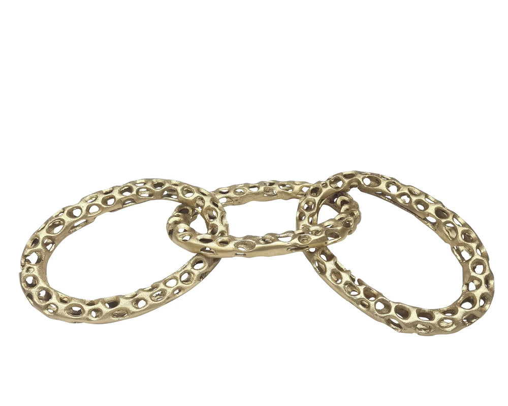 Three gold rings stacked on a white background