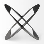 A round, black metal decorative object with a geometric design.