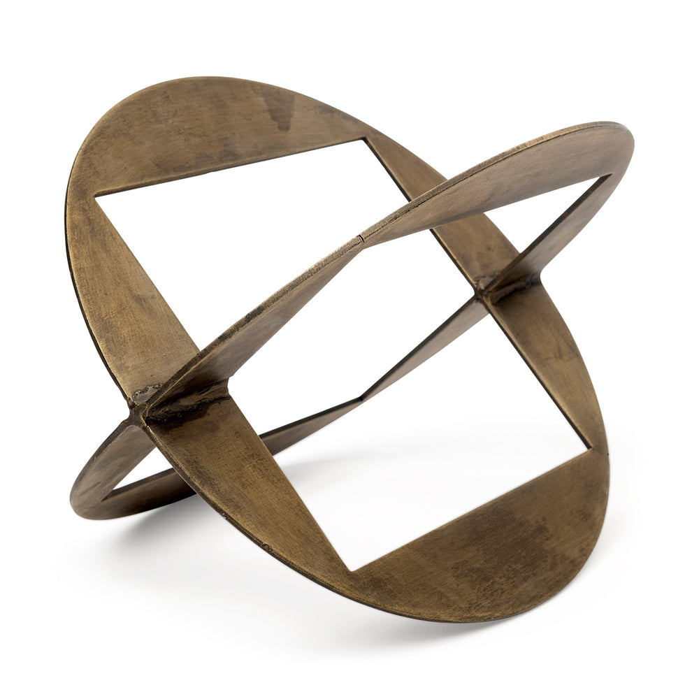 A round,glod metal decorative object with a geometric design.