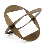 A round,glod metal decorative object with a geometric design.