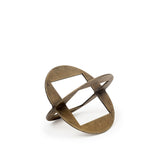 A round, brass metal decorative object with a geometric design.