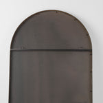 The back of a  full-length mirror with gold finished on a white background