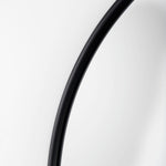 Close up to a full-length mirror with black finished on a white background