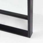 Close up to a full-length mirror with black finished on a white background
