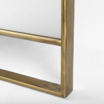 Close-up to a  full-length mirror with gold finished on a white background