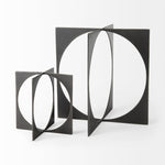 Bronze decorative object with geometric design on a white background