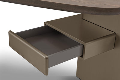 Brown drawer being pulled out from a wooden surface