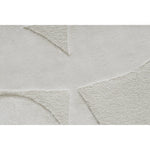 Close-up of a textured gray rug with geometric patterns