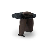 Modern side table with black marble top and wooden base on a white background