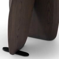Close-up of a dark wooden stool on a white background