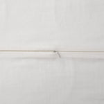 Close-up of a white fabric with a thin brown line running horizontally.