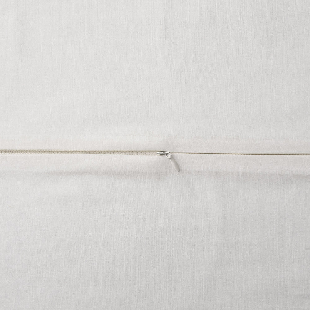 Close-up of a white fabric with a thin brown line running horizontally.