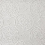 Textured white paper with circular and geometric patterns