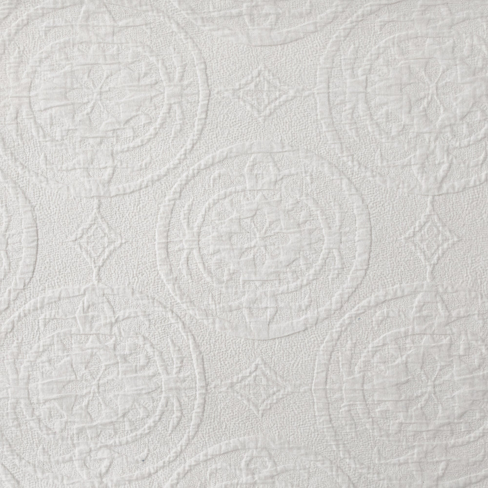 Textured white paper with circular and geometric patterns
