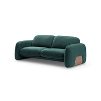 Green sofa with a brown patch on a white background