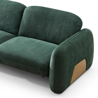 Green velvet sofa with a brown patch on a white background