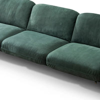 Green velvet sofa on a white background
