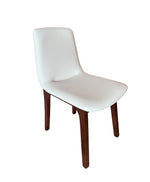 White chair with wooden legs on a white background