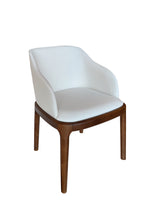 White chair with wooden legs on a white background