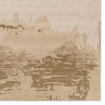 Textured beige rug with abstract pattern