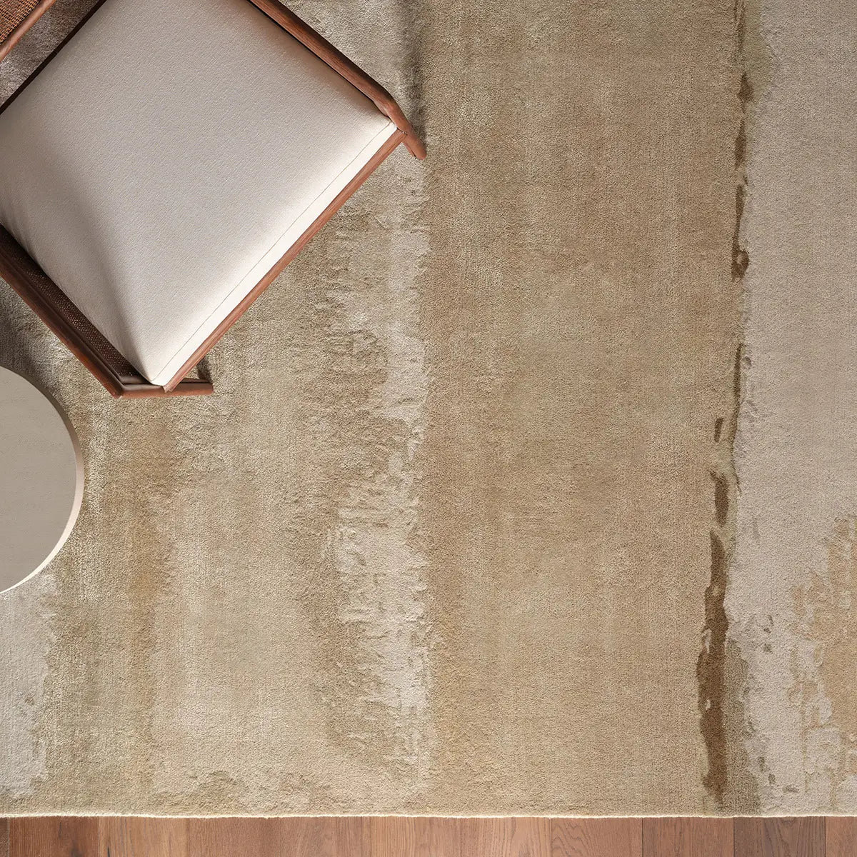 Textured beige rug with a chair and table in the corner