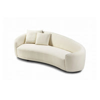 Beige sofa with two cushions on a white background