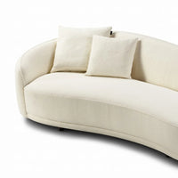 Beige sofa with two cushions on a white background