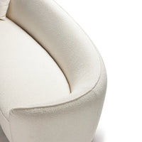 Close-up of a textured beige chair on a white background