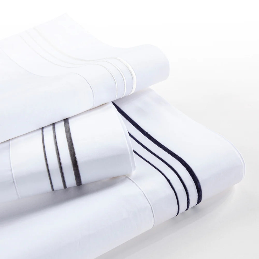 White bath towels with black stripes on a white background