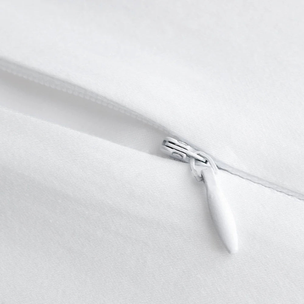 Close-up of a zipper on a white fabric background