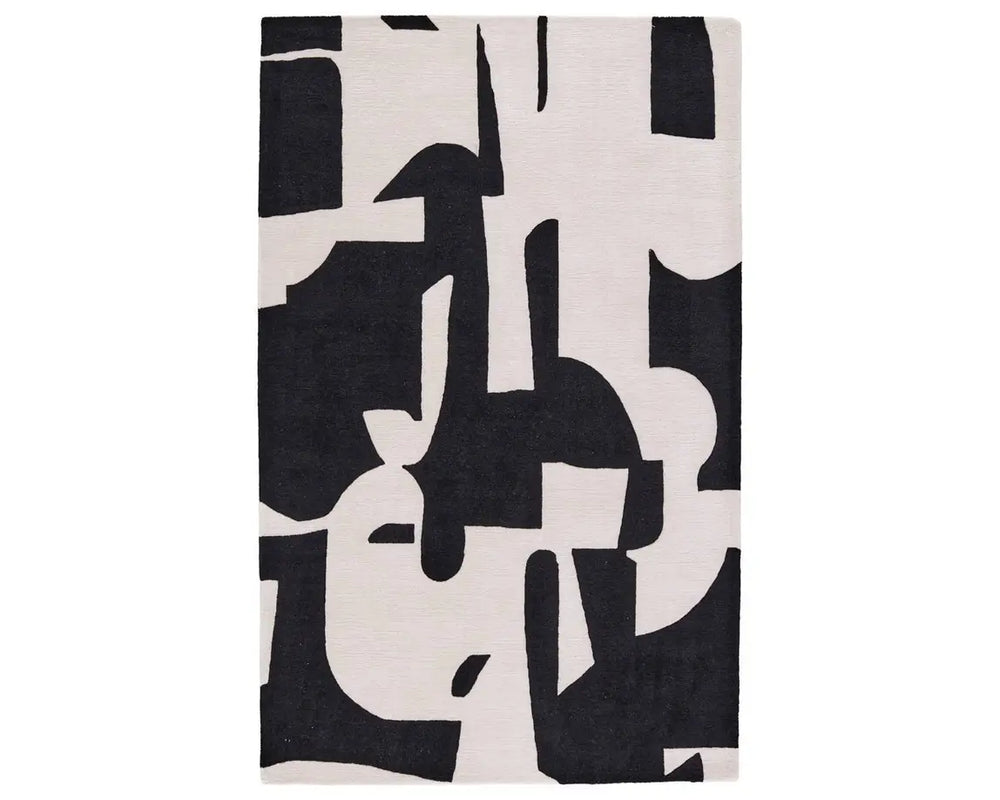 A black and white geometric patterned area rug.