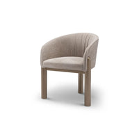 Beige armchair with wooden legs on a white background
