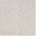 Textured gray rug with a subtle pattern on a white background