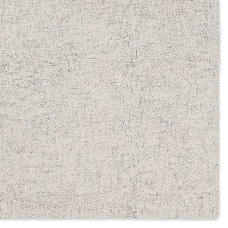 Textured gray rug with a subtle pattern on a white background