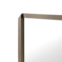 Rectangular mirror with a bronze frame on a white background