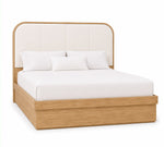 A modern platform bed with a light oak wood frame and a tall, curved upholstered headboard in off-white fabric, shown with white bedding on a solid white background.
