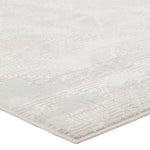 Close-up of a textured white rug with subtle patterns