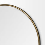 A 47-inch round mirror with a gold antique finish frame.