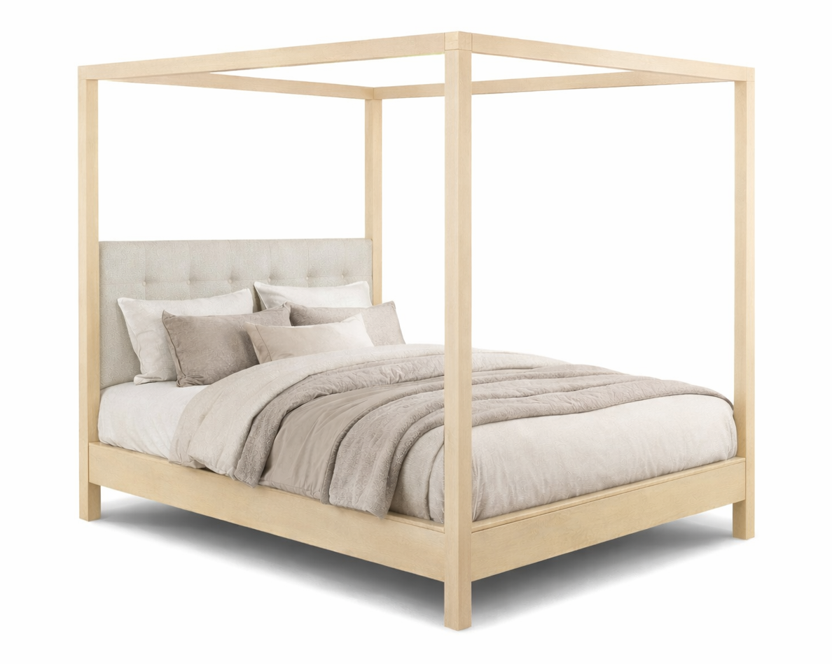 Wooden canopy bed with bedding on a white background